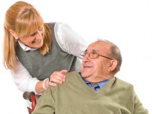 image of happy man in a wheelchair smiling at a woman; they are happy because of GreenLight Mobility