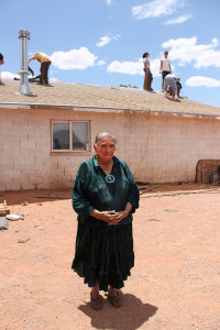 an old woman's home being repaired by some people