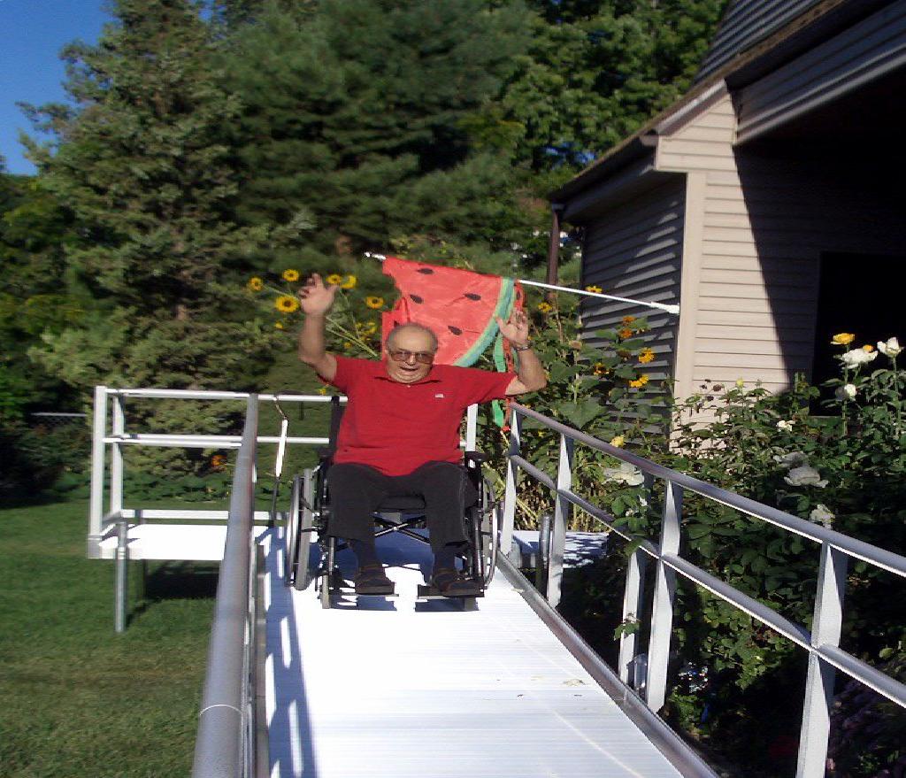 Senior trying out his new wheelchair ramp