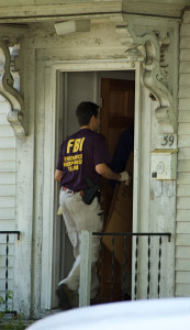 FBI agent entering senior citizen's home.