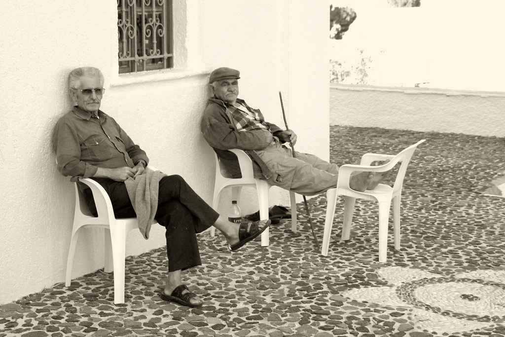 Old men resting after the exercise.